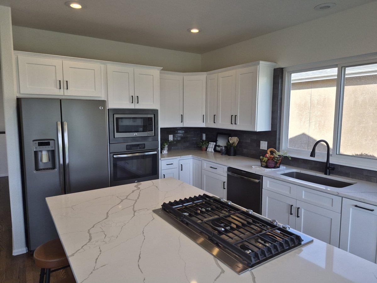 Bright white shaker kitchen after cabinet refinishing